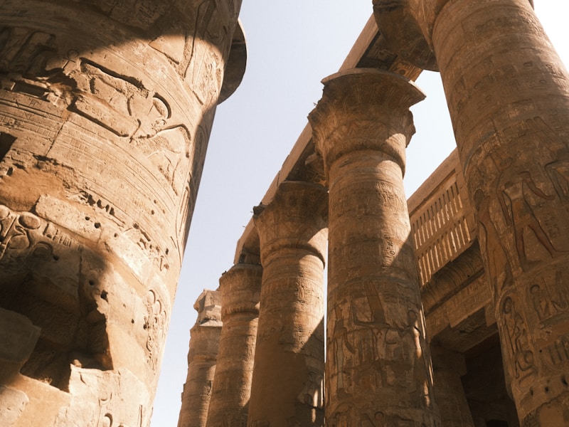 Painted rock-cut tomb facade at Beni Hasan with columns carved from the cliff